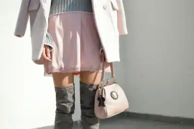Plague Doctor Charm attached to a woman's pink purse, showing the charm's versatility.