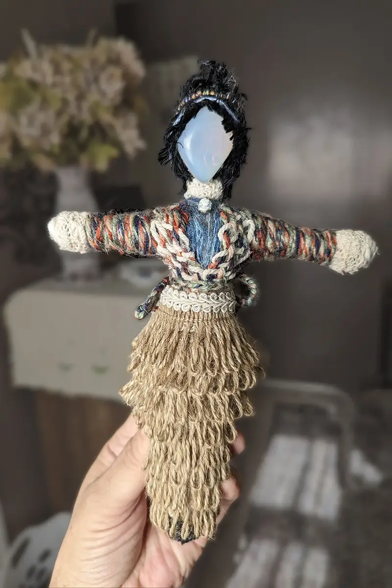 Custom You-Do-You Voodoo™ doll with moonstone head, black hair, the traditional 't' shape and detailed clothing.