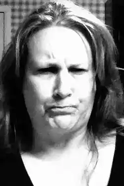 Reference photo of a woman making an expression used for the painting 'Disturbed'.