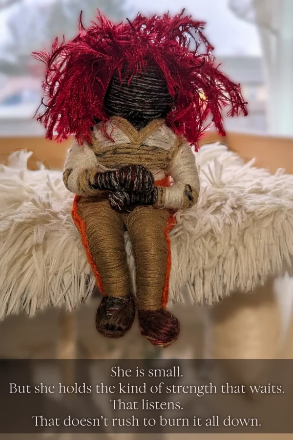 Silma the custom spirit doll sits, waiting for her anger to subside,, her red hair sparking.