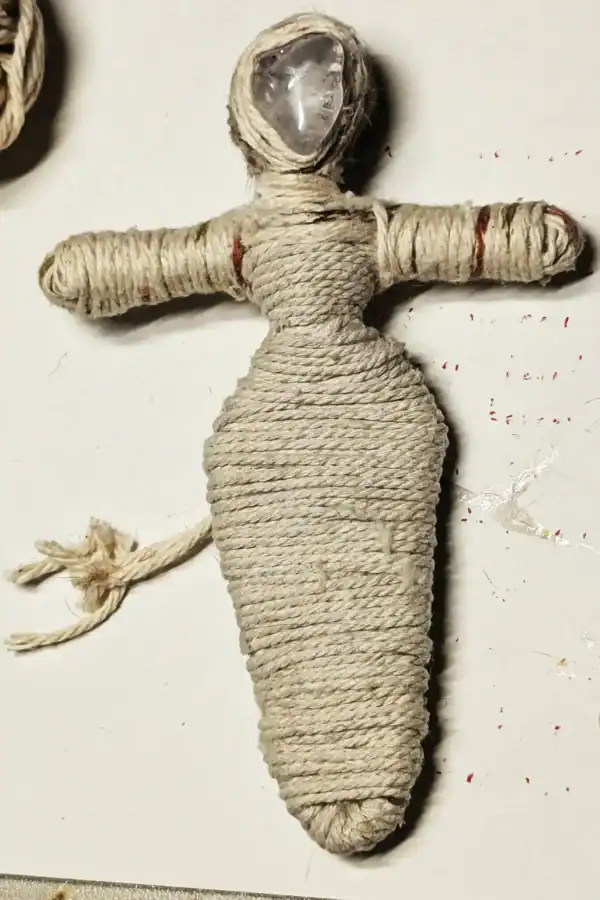 Unfinished Brigit You-Do-You Voodoo™ doll showing base layer of natural cord, with a clear quartz crystal head and early skin-tone binding in progress.