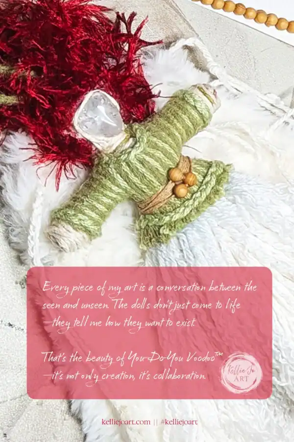 Partially completed Brigit doll with clear quartz head and red hair, resting on textured fabric. Green yarn clothing and natural materials visible mid-creation.