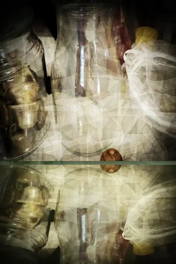 Glass jars, some holding artistic materials in Kellie Jo Art’s studio.