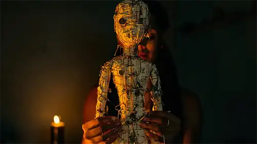 Person holding a handmade doll
